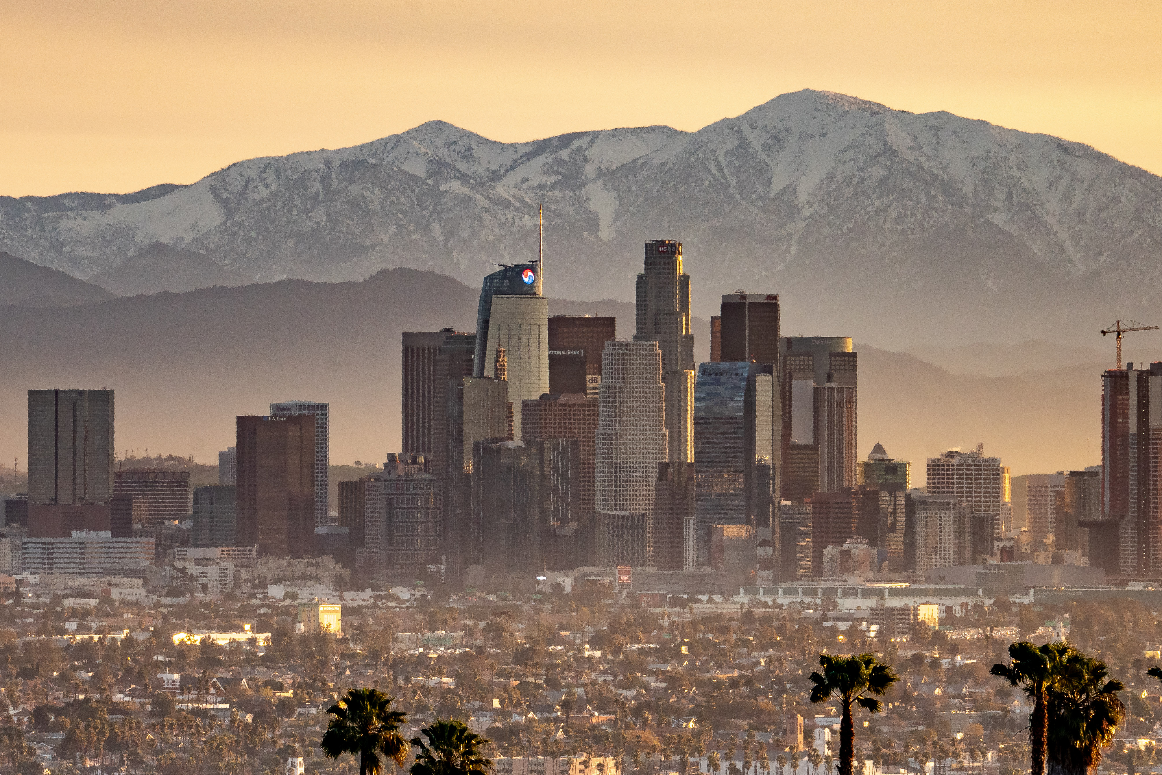 Los Angeles cityscape snowcapped mountains