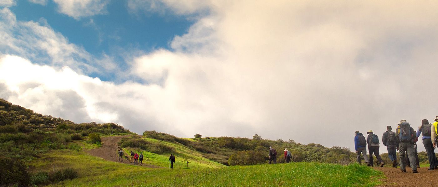Angeles hikers on a green ridge