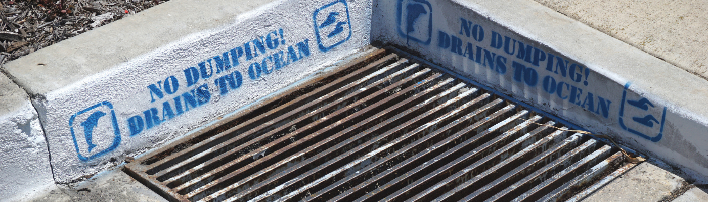 No dumping drains to ocean sign on storm drain