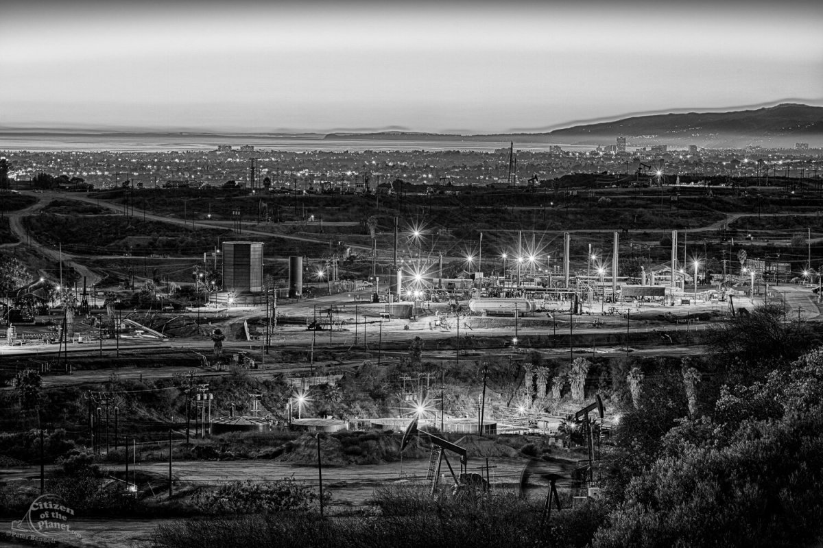 Inglewood Oil Field, one of the largest urban oil fields in the country, with city of Santa Monica and Malibu coastline in the background. By Peter Bennett