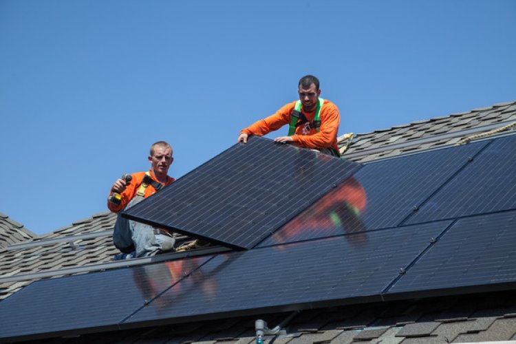 Photographs of solar panels being installed on homes in Alameda, California Taken by photographer He