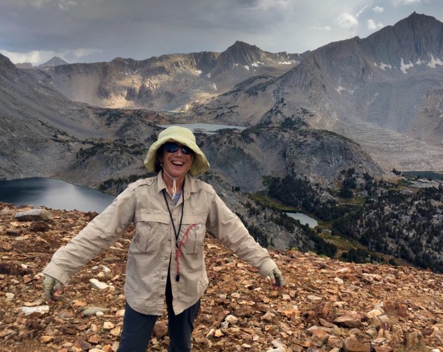 Angeles Chapter Outings Leader Jane Simpson on a mountain ridge