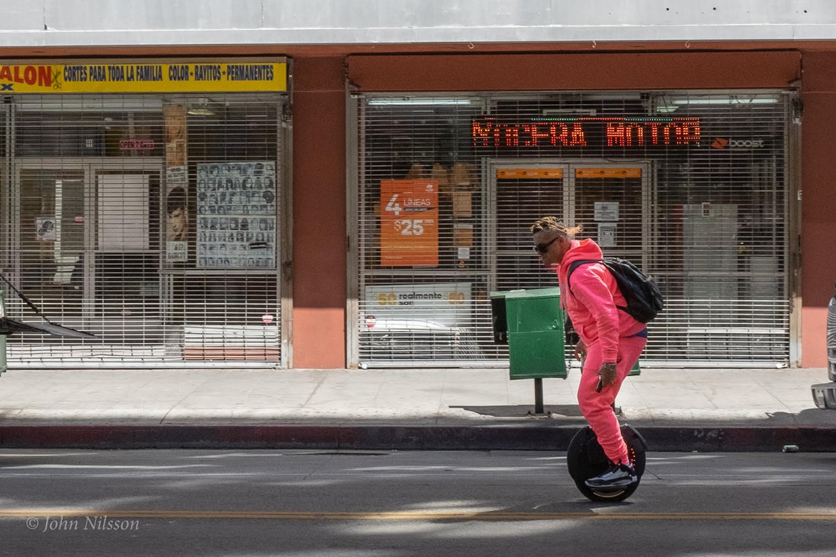 Man rides electric unicycle through Downtown Los Angeles’ Diamond District, John Nilsson all rights reserved